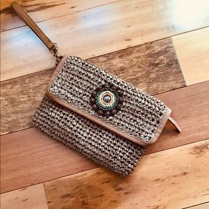 Cato straw wristlet with beading detail.
